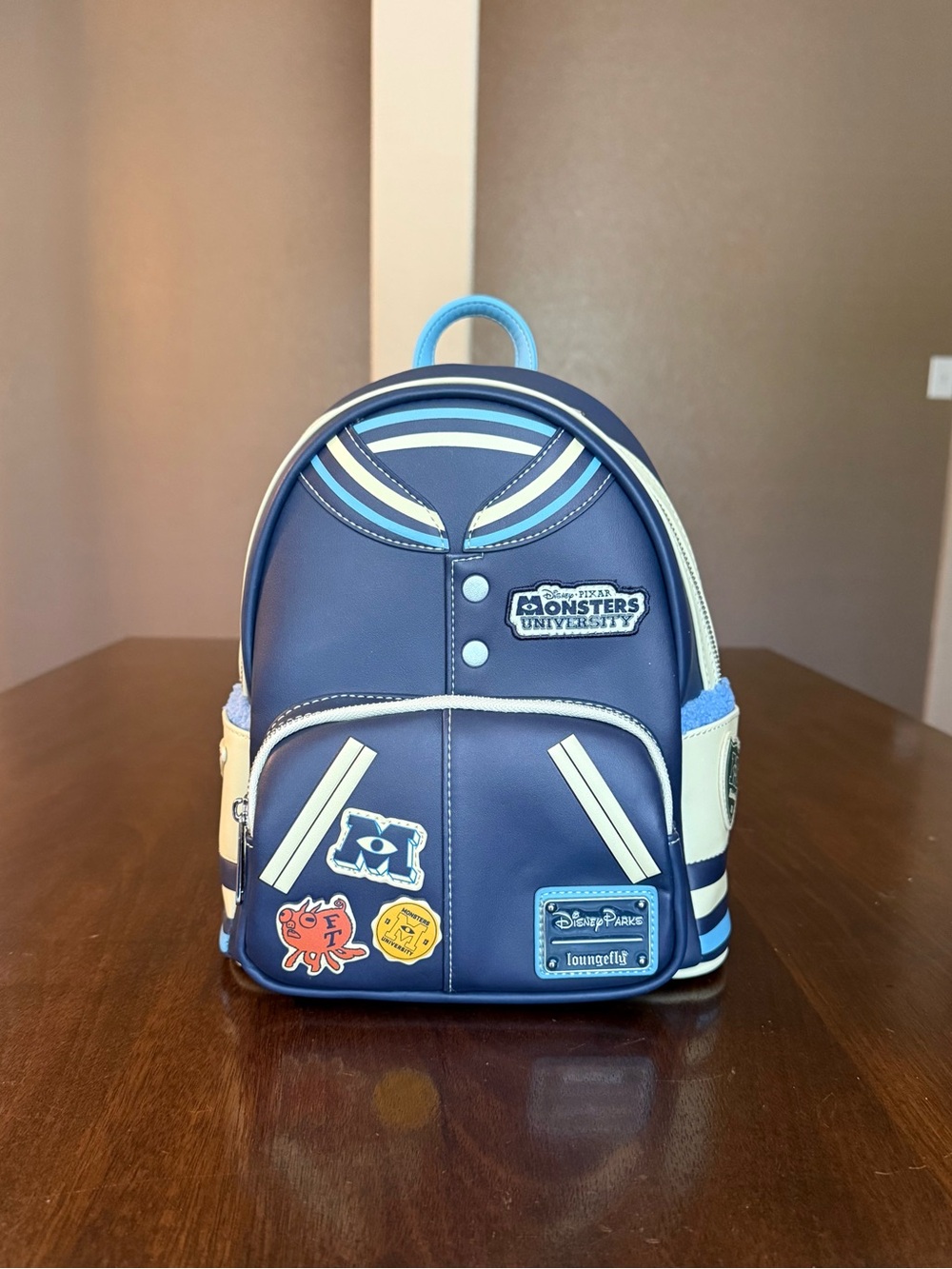 Loungefly Disney Parks Monsters University Varsity Jacket Mini Backpack